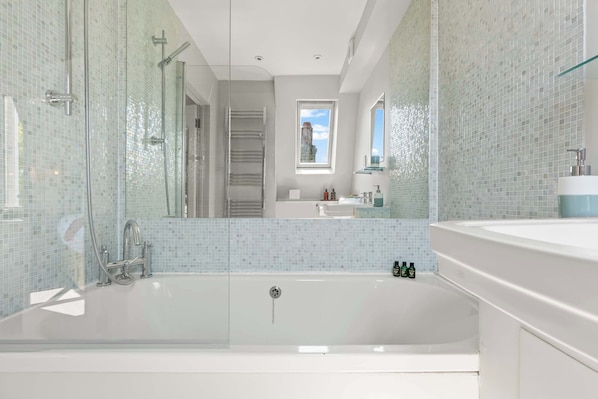 Shower, hair dryer, towels, shampoo