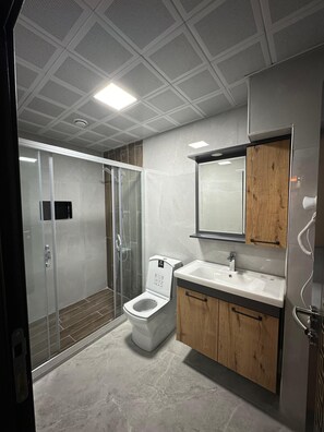 Shower, hair dryer, towels, soap