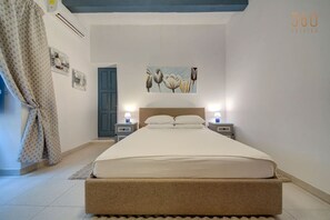 1 bedroom, desk, iron/ironing board, travel crib