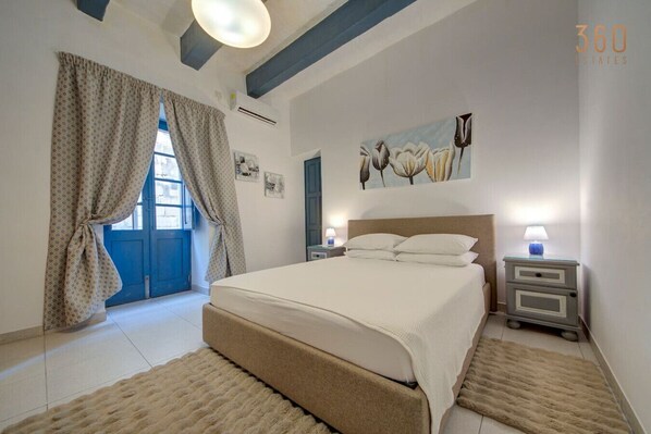 1 bedroom, desk, iron/ironing board, travel crib