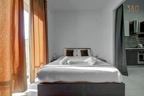 1 bedroom, desk, iron/ironing board, travel cot