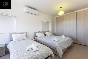 4 bedrooms, desk, iron/ironing board, travel cot