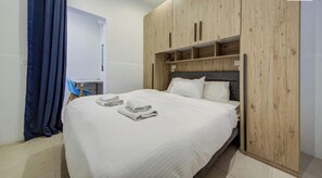 1 bedroom, desk, iron/ironing board, travel crib