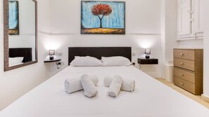 1 bedroom, desk, iron/ironing board, travel crib