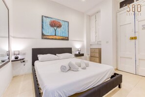 1 bedroom, desk, iron/ironing board, travel crib