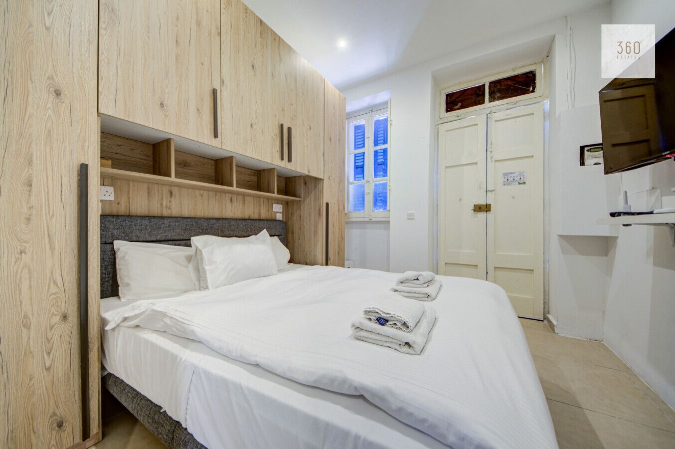 1 bedroom, desk, iron/ironing board, travel crib