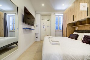 1 bedroom, desk, iron/ironing board, travel cot