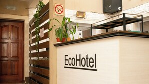 A reception desk with the sign "EcoHotel" and a no-smoking sign above it. - Hotel del Monumento (Salta)