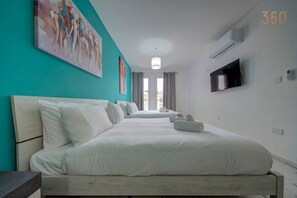 1 bedroom, desk, iron/ironing board, travel crib