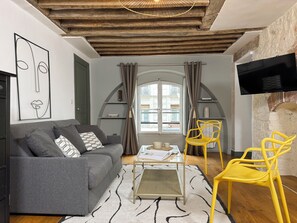 Signature Apartment, City View | Living area | 80-cm Smart TV with digital channels