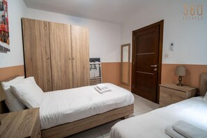 4 bedrooms, desk, iron/ironing board, travel cot