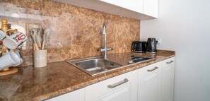 Fridge, microwave, oven, stovetop - Serene Apt with Terrace & Pool & BBQ Access,Qala (Qala)