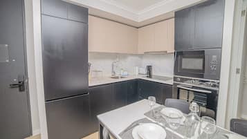 Standard Apartment | Private kitchen | Fridge, microwave, oven, stovetop