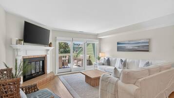 Älytelevisio, pöytätennispöytä, tulostin