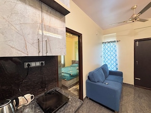 Appartement Deluxe, vue ville | Coin séjour