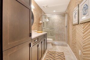Shower, hair dryer, towels, soap
