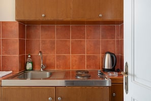 Fridge, stovetop, electric kettle, high chair