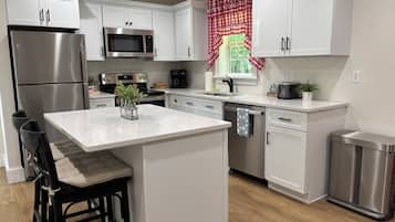Coffee/tea maker, fridge, microwave, oven