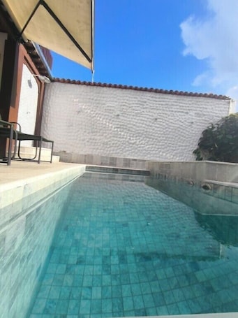 Outdoor pool, open 9:00 AM to 10:00 PM, sun loungers