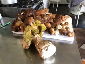 A variety of baked goods on a stainless steel counter. - FARM IL POGGIOLINO (Pelago)
