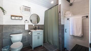 Shower, towels, soap, toilet paper