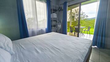 Standard Apartment, Garden View | In-room safe, blackout drapes, iron/ironing board, free WiFi