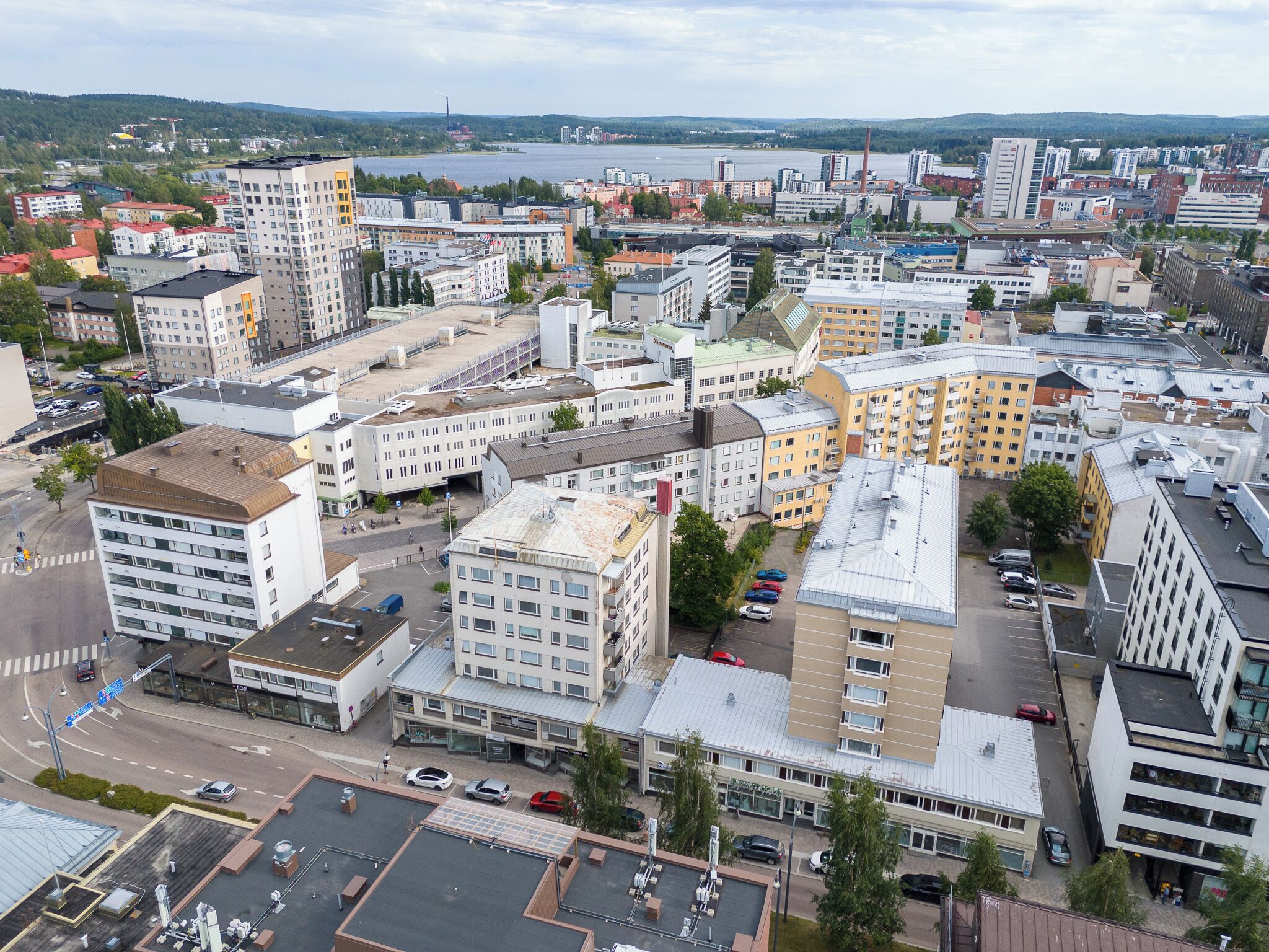 A cityscape with various buildings, including a mix of residential and commercial structures.