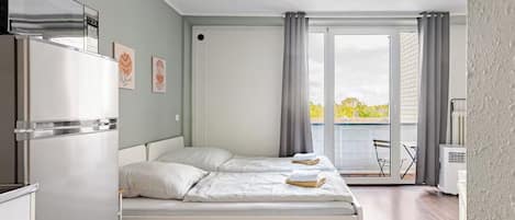 1 bedroom, desk, iron/ironing board, travel crib