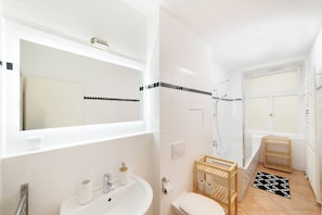Shower, hair dryer, towels, soap
