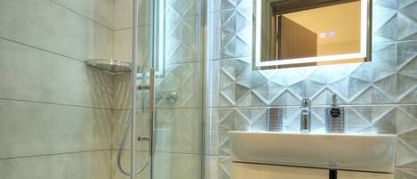 Shower, hair dryer, towels, soap