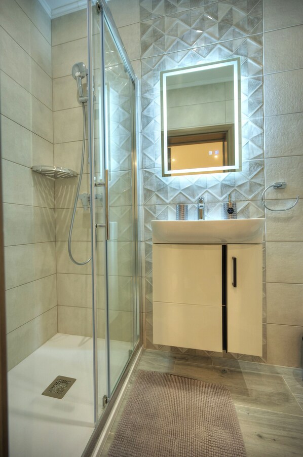 Shower, hair dryer, towels, soap