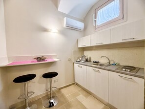 Fridge, coffee/tea maker, cookware/dishes/utensils