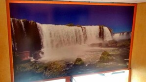 A large poster of a waterfall. - Hotel Flert Santana (Sao Paulo)