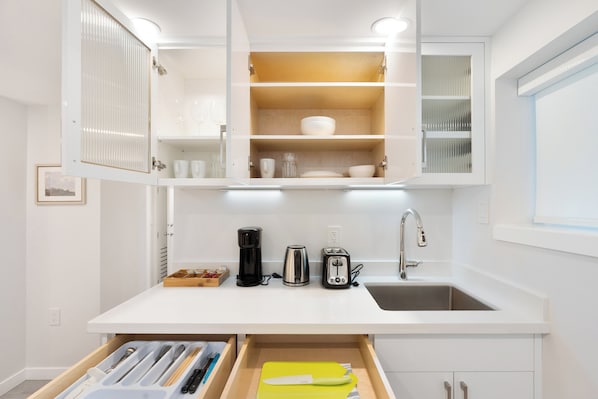 Fridge, microwave, coffee/tea maker, toaster