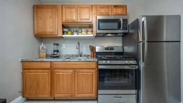 Fridge, microwave, stovetop, coffee/tea maker