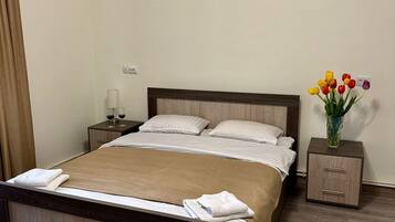 Premium bedding, down comforters, desk, laptop workspace