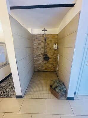 Shower, hair dryer, towels, soap