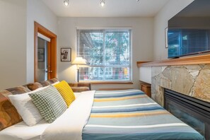 1 bedroom, desk, iron/ironing board, travel crib
