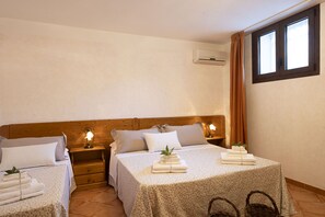 Classic Triple Room, Patio | Blackout drapes, free WiFi