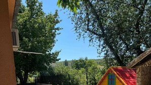 A children's play area with a small house, a slide, and a swing set. - Villa Josefina – Heated Pool Holiday Home near Split, Trilj (Košute)
