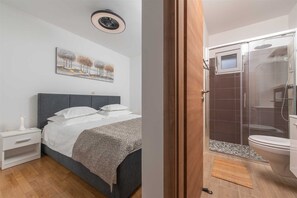 Shower, eco-friendly toiletries, hair dryer, towels
