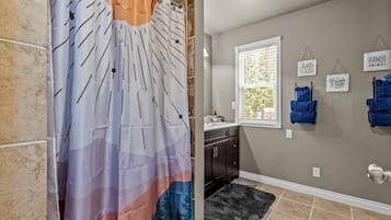 Shower, hair dryer, towels, shampoo