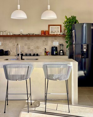 Fridge, microwave, stovetop, coffee/tea maker