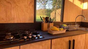 Fridge, stovetop, coffee/tea maker, cookware/dishes/utensils