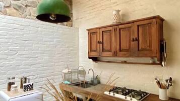 Fridge, stovetop, coffee/tea maker, cookware/dishes/utensils