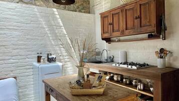Fridge, stovetop, coffee/tea maker, cookware/dishes/utensils