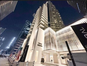 A modern hotel with a distinctive angular facade and a prominent entrance.