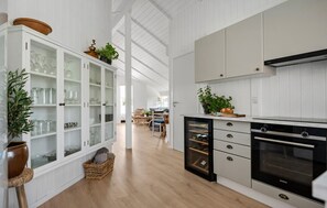 Fridge, stovetop, dishwasher, coffee/tea maker