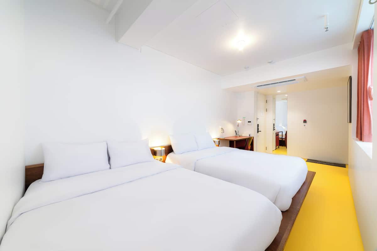 Family Room, Private Bathroom, City View | Individually decorated, individually furnished, desk, blackout drapes