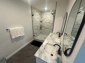 Shower, towels, soap, toilet paper